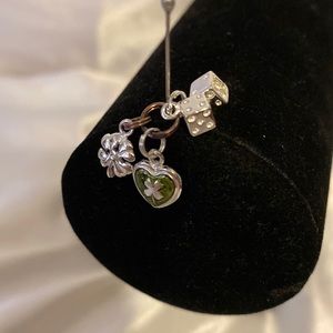 Silver shamrock and dice charm